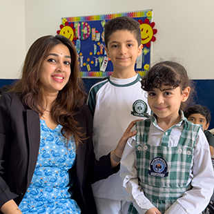 CBSE primary school in kuwait Teachers guiding primary students